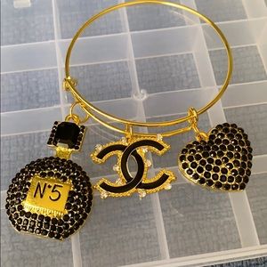 Gold plated bangle with charms